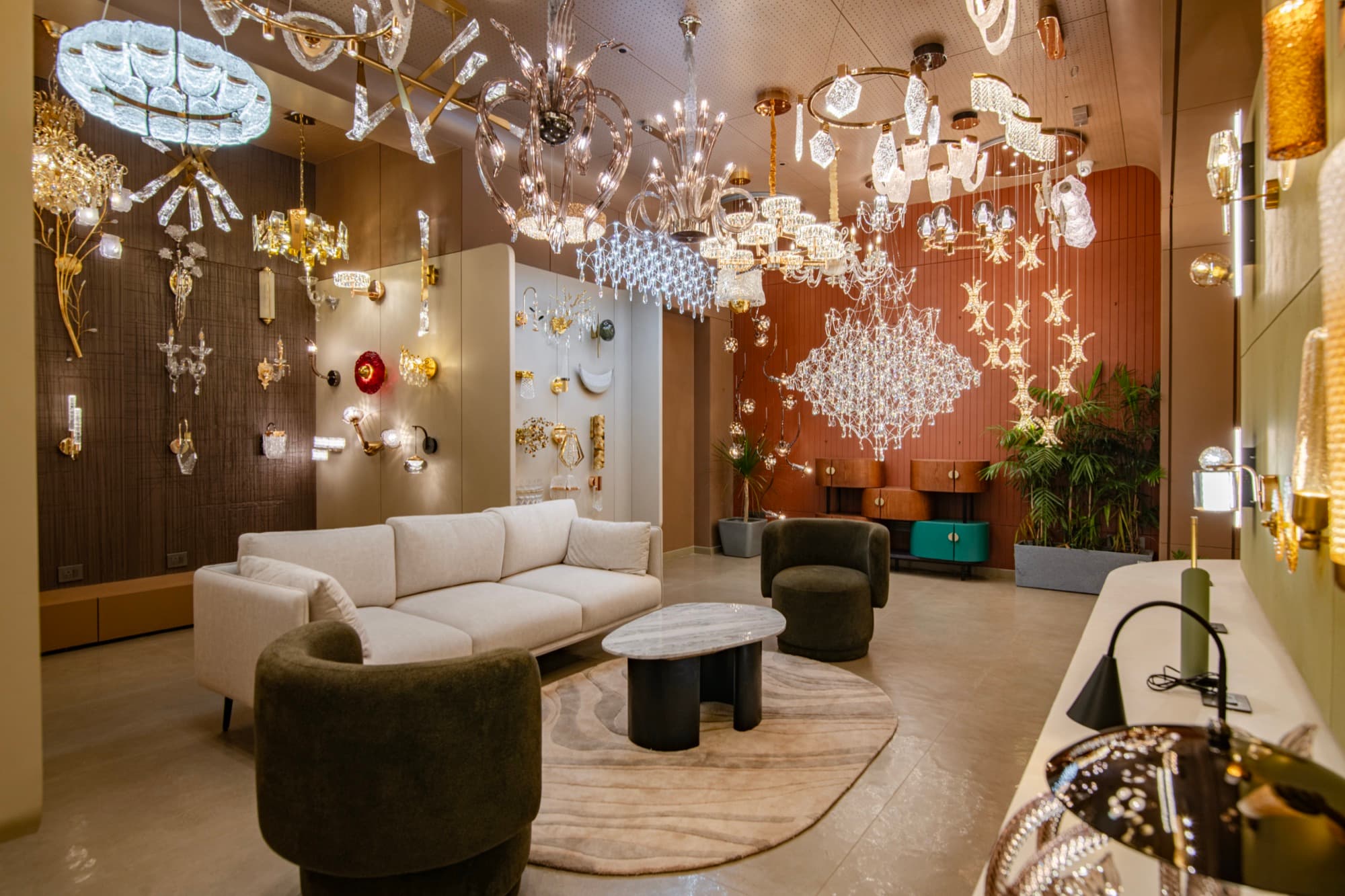 The Arcis Lumina showroom lounge beneath a display of crystal chandeliers